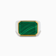 The Men's 925 Sterling Silver Malachite Signet Ring features a rectangular green malachite stone with gold trim and a sterling silver band, displayed front-facing on a white background—a bold yet classic accessory.