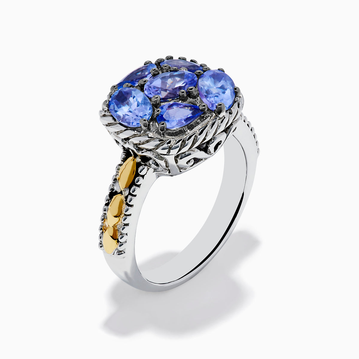 The 925 Sterling Silver and 18K Yellow Gold Tanzanite Ring features intricate rope detailing and a cluster of five marquise and oval blue gemstones, highlighted by yellow gold accents along the band.