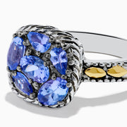 The 925 Sterling Silver and 18K Yellow Gold Tanzanite Ring features intricate rope detailing and a cluster of five marquise and oval blue gemstones, highlighted by yellow gold accents along the band.