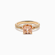 The 18K Rose Gold Morganite and Diamond Split Band Solitaire Ring showcases a large cushion-cut peach morganite center stone, accented by two rows of sparkling white diamonds along the elegant split shank.