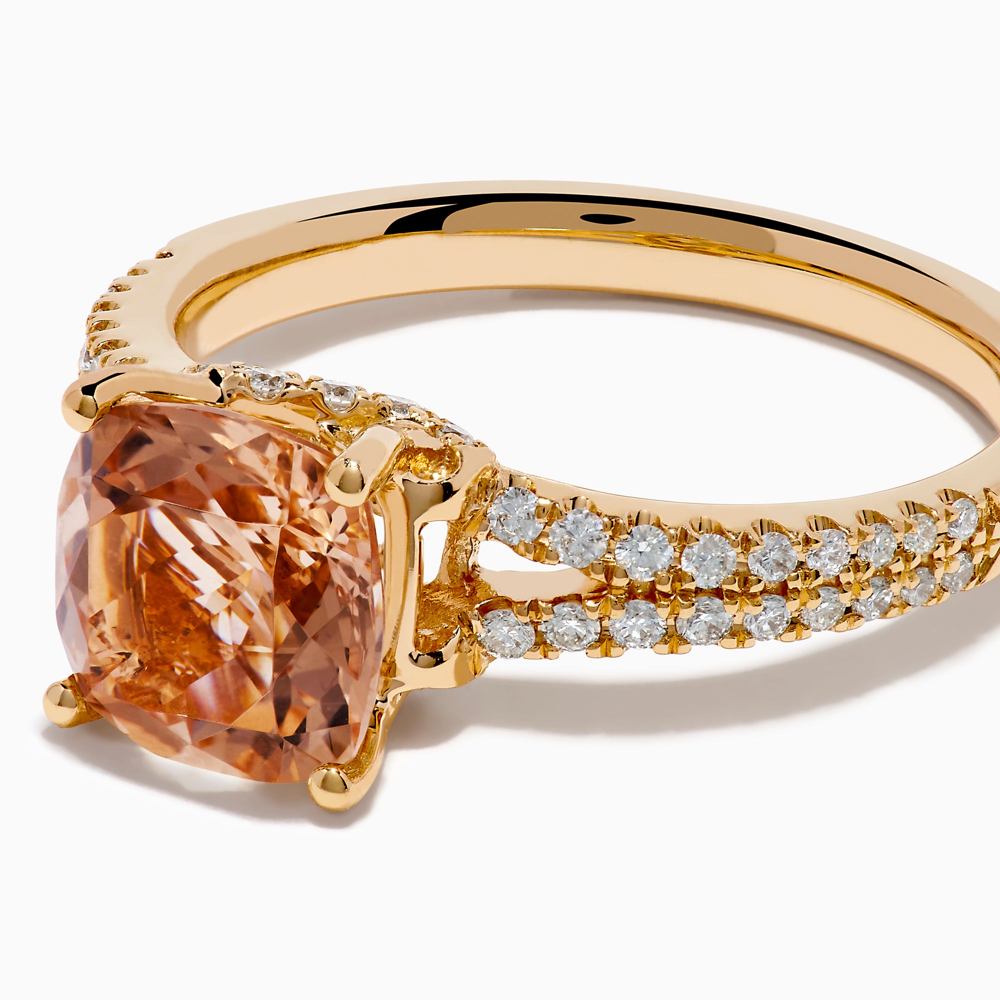 The 18K Rose Gold Morganite and Diamond Split Band Solitaire Ring showcases a large cushion-cut peach morganite center stone, accented by two rows of sparkling white diamonds along the elegant split shank.