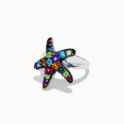 The 925 Sterling Silver Multi Color Gemstone Starfish Ring features a bold starfish design set with blue, green, purple, red, and orange gemstones against a white background.