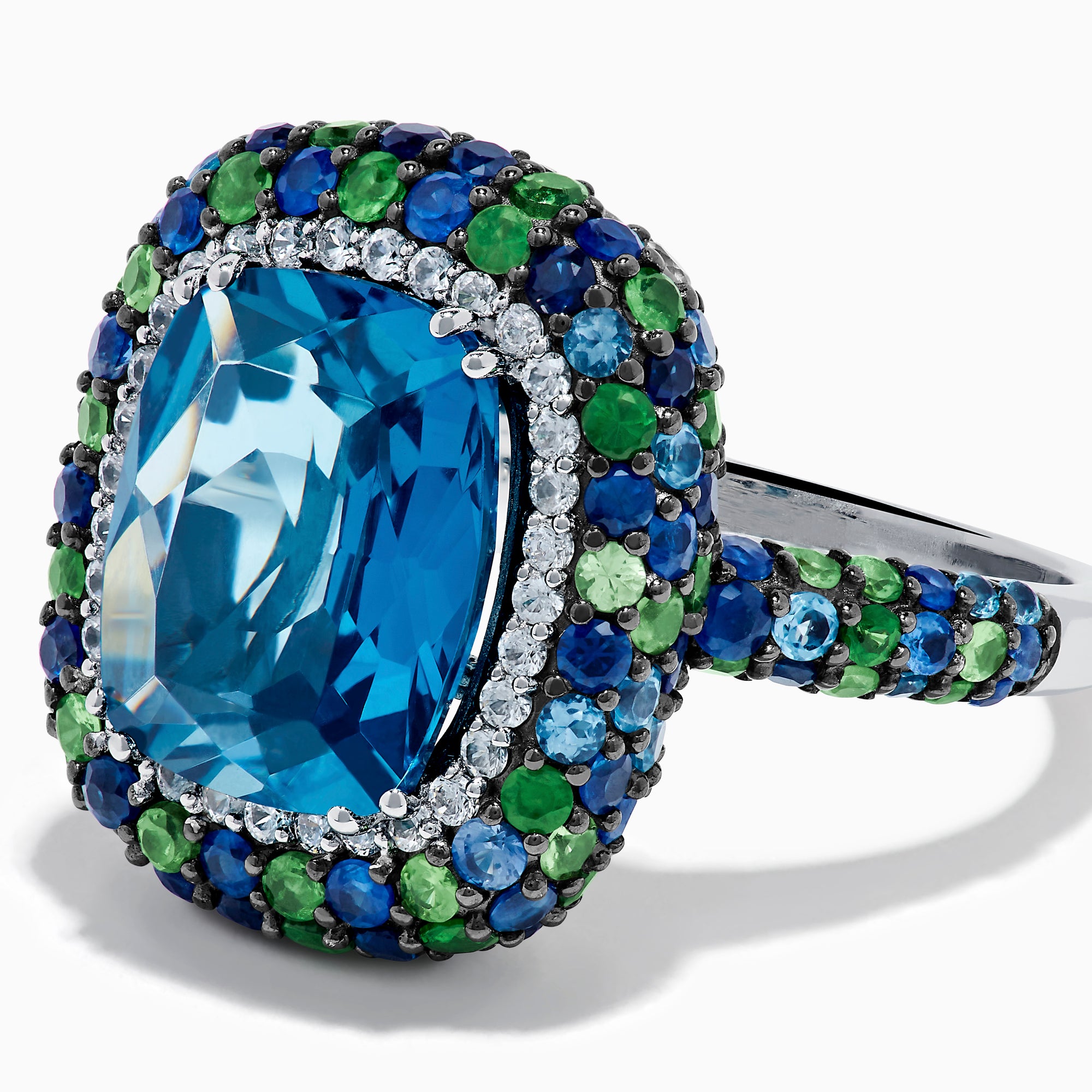 The 925 Sterling Silver Blue Topaz Cushion Multi Gemstone Halo Ring features a large rectangular blue topaz center, encircled by a halo of small white, green, and blue stones.
