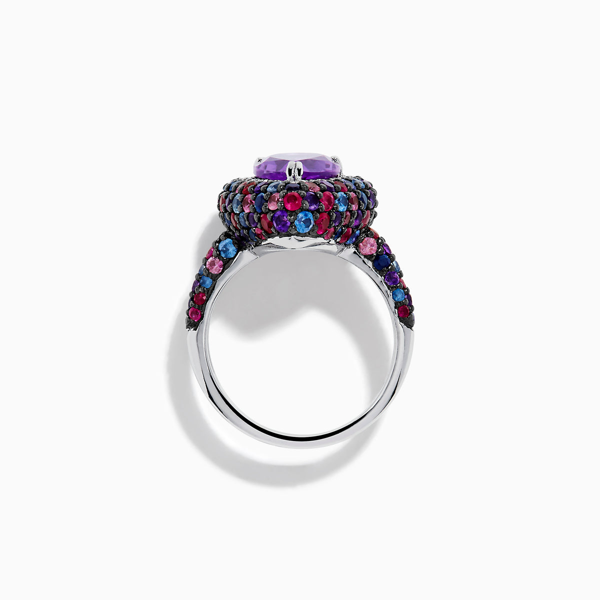 The 925 Sterling Silver Amethyst Pear Multi Gemstone Halo Ring features a pear-shaped amethyst surrounded by a pavé band with blue, pink, and red stones, creating a vibrant halo effect around the center gem.