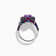 The 925 Sterling Silver Amethyst Pear Multi Gemstone Halo Ring features a pear-shaped amethyst surrounded by a pavé band with blue, pink, and red stones, creating a vibrant halo effect around the center gem.