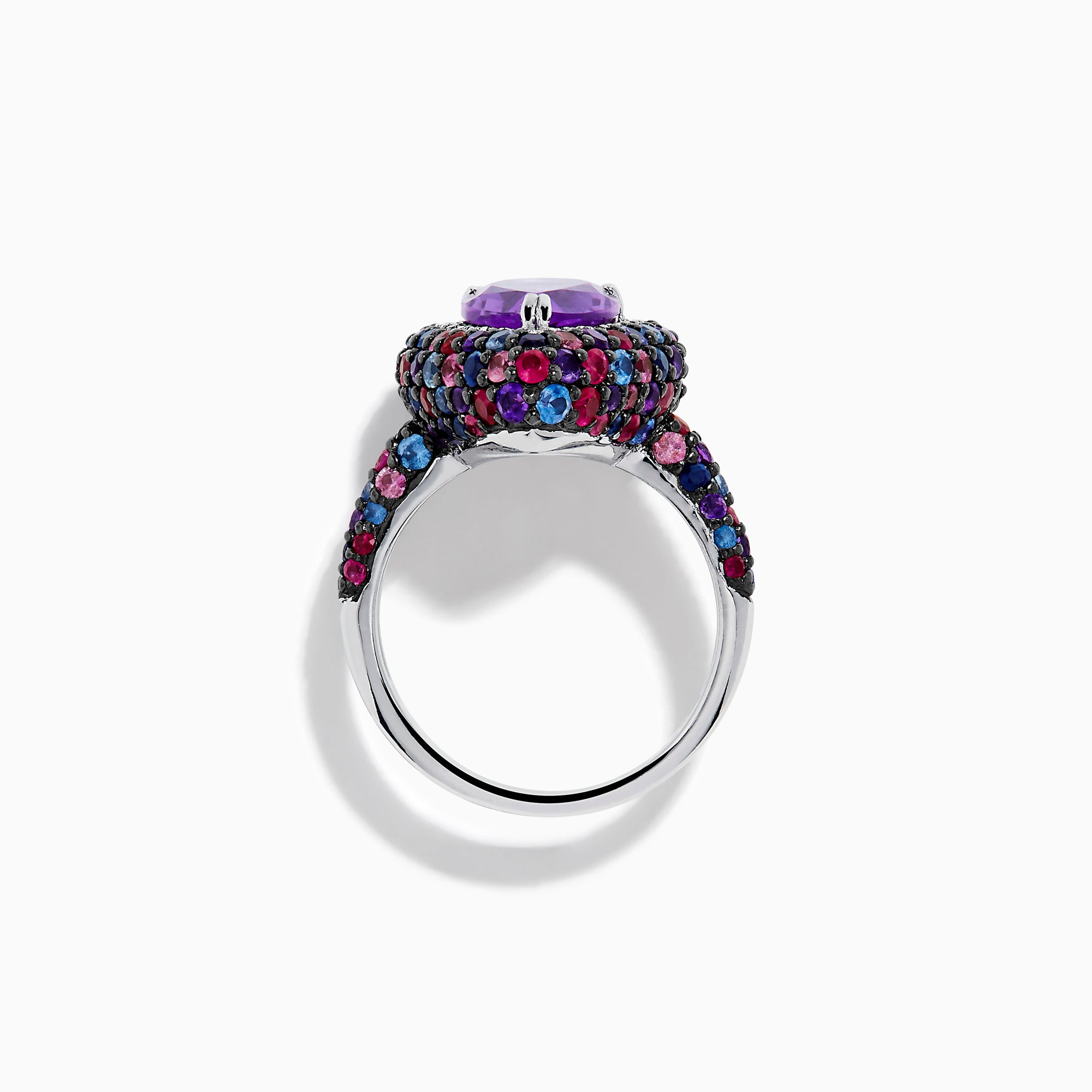 The 925 Sterling Silver Amethyst Pear Multi Gemstone Halo Ring features a pear-shaped amethyst surrounded by a pavé band with blue, pink, and red stones, creating a vibrant halo effect around the center gem.