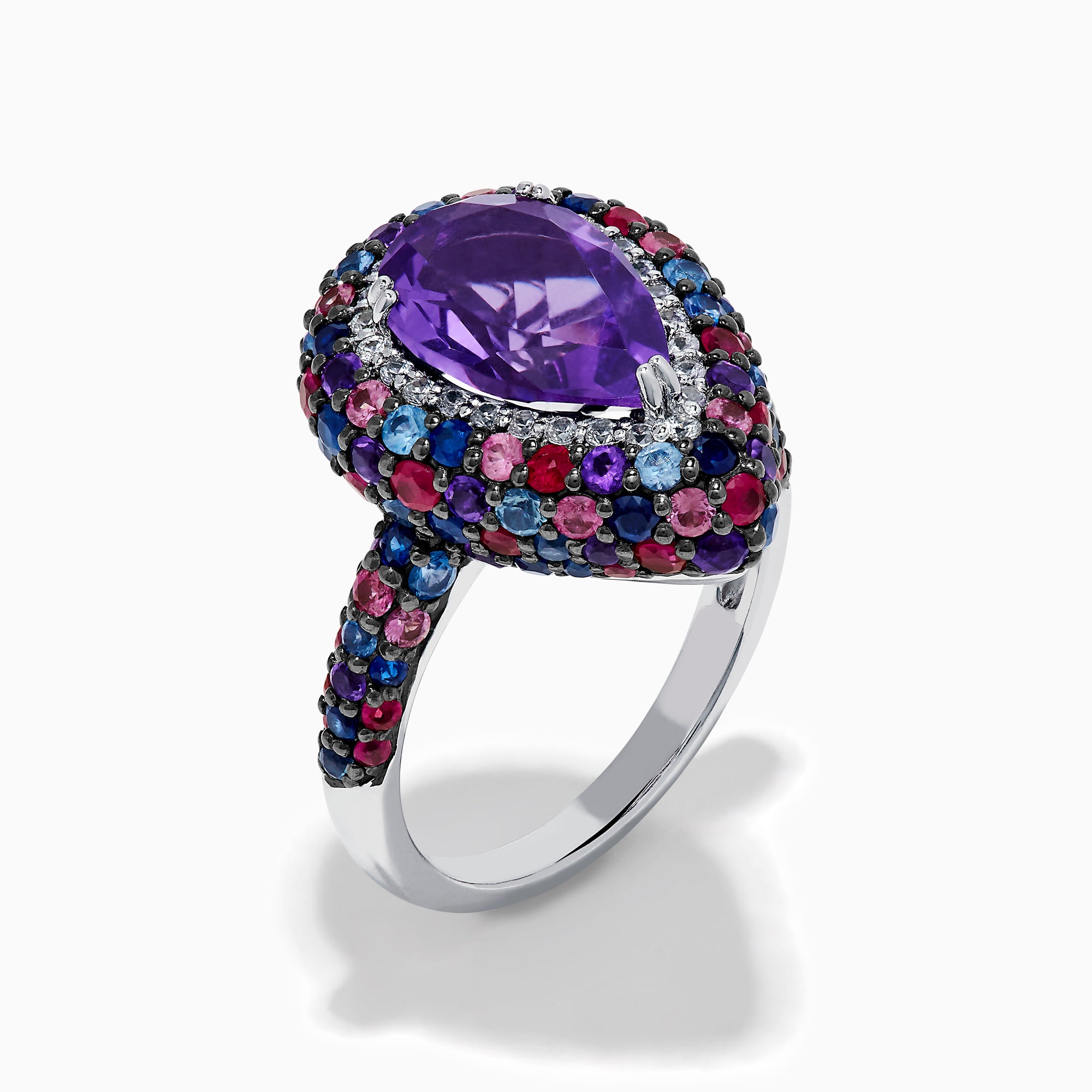 The 925 Sterling Silver Amethyst Pear Multi Gemstone Halo Ring features a pear-shaped amethyst surrounded by a pavé band with blue, pink, and red stones, creating a vibrant halo effect around the center gem.