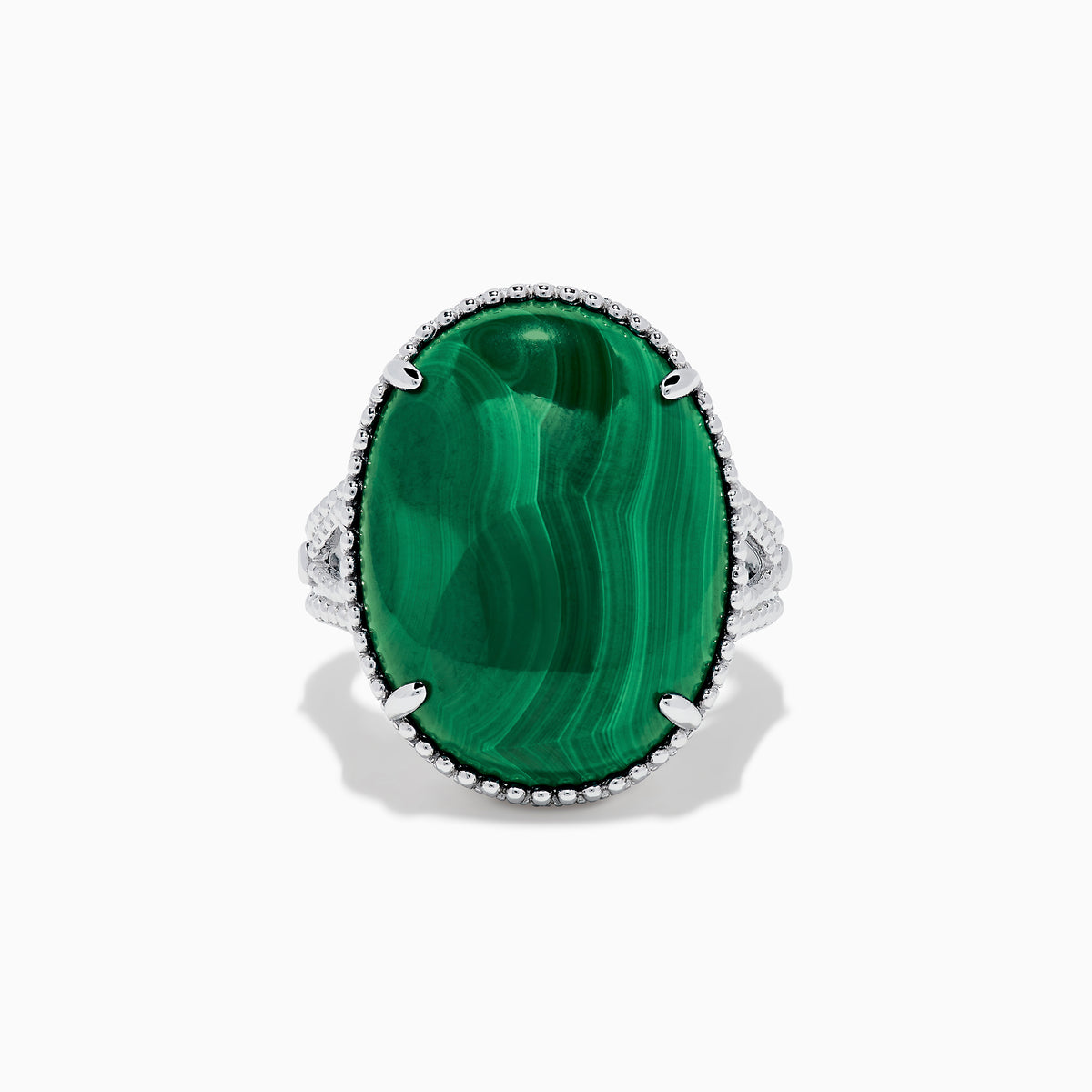 The 925 Sterling Silver Malachite Oval Ring showcases a large, oval green malachite stone with natural banding, set in four prongs and finished with decorative bead accents for a striking look.