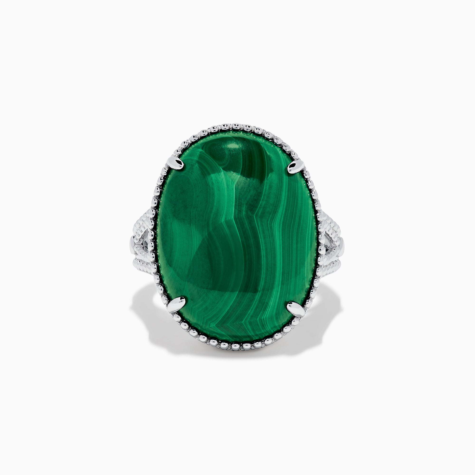 The 925 Sterling Silver Malachite Oval Ring showcases a large, oval green malachite stone with natural banding, set in four prongs and finished with decorative bead accents for a striking look.