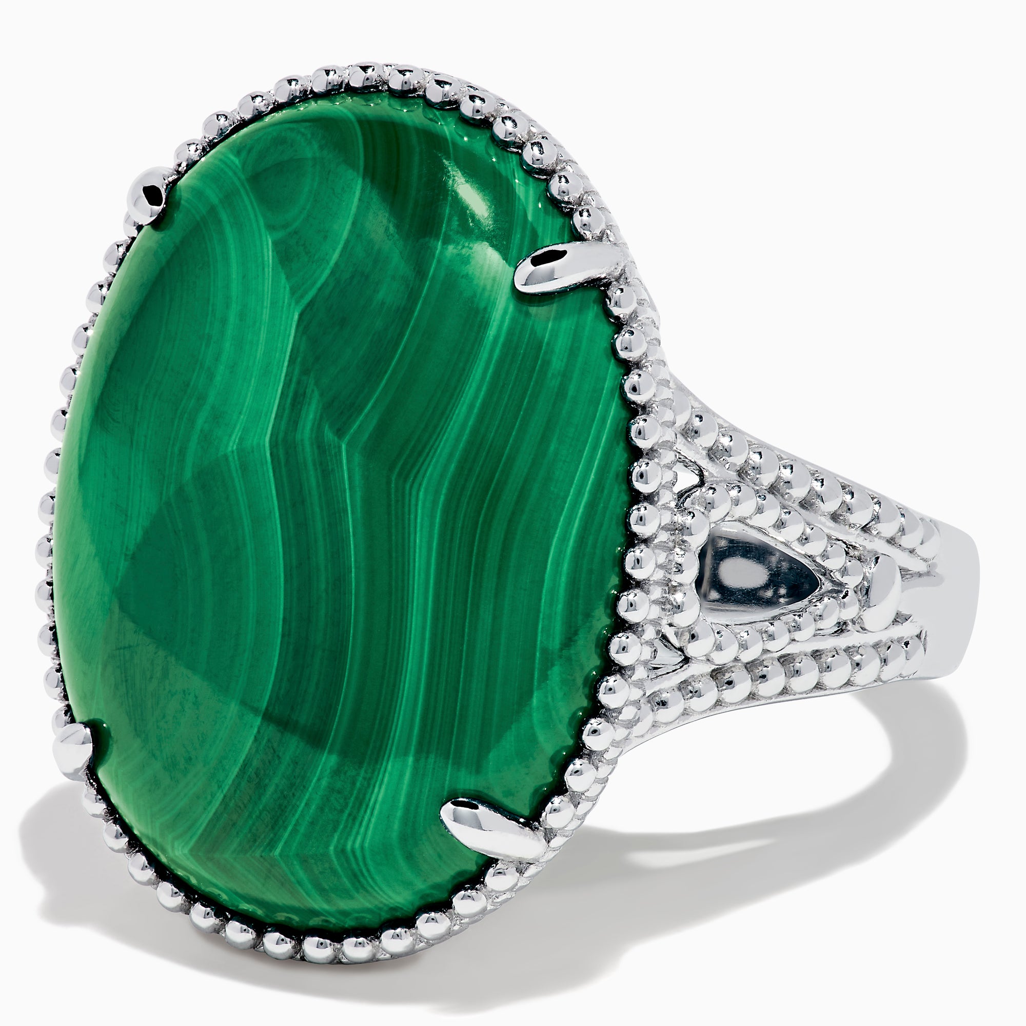 The 925 Sterling Silver Malachite Oval Ring showcases a large, oval green malachite stone with natural banding, set in four prongs and finished with decorative bead accents for a striking look.