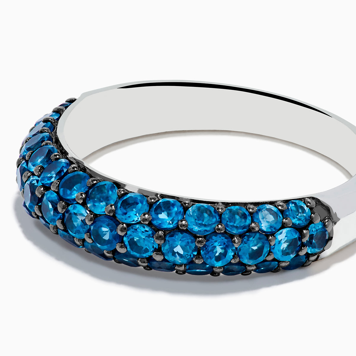 The 925 Sterling Silver London Blue Topaz Wedding Band features two rows of sparkling blue topaz gemstones, beautifully presented on a white background.