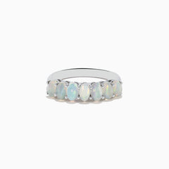 The Aurora 925 Sterling Silver Opal Ring showcases seven oval opals with iridescent hues, set closely on a sleek sterling silver band.