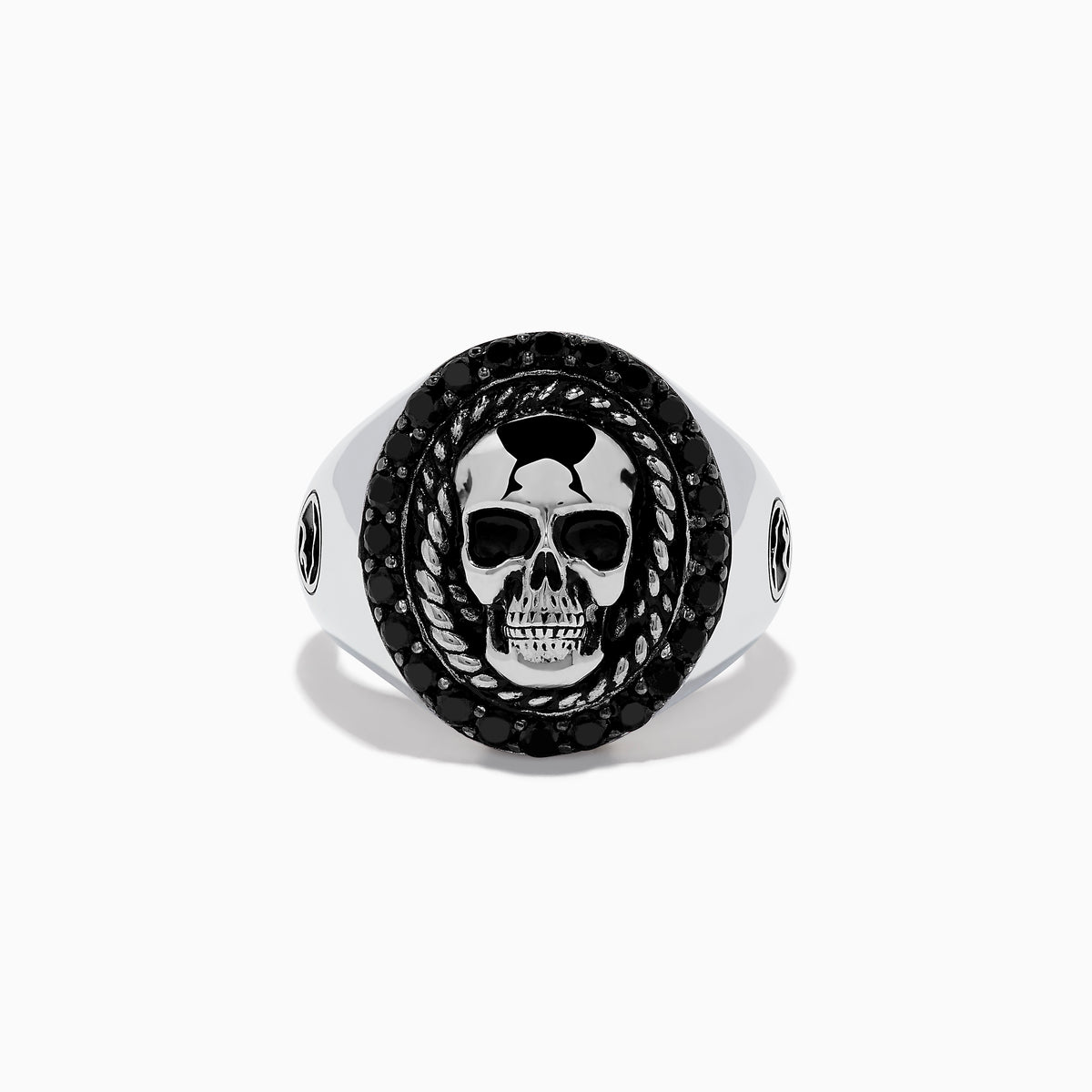 The Mens 925 Sterling Silver Black Spinel Skull Ring showcases a detailed central skull, an oval border set with black spinel stones, twisted metal accents, and small decorative side elements.