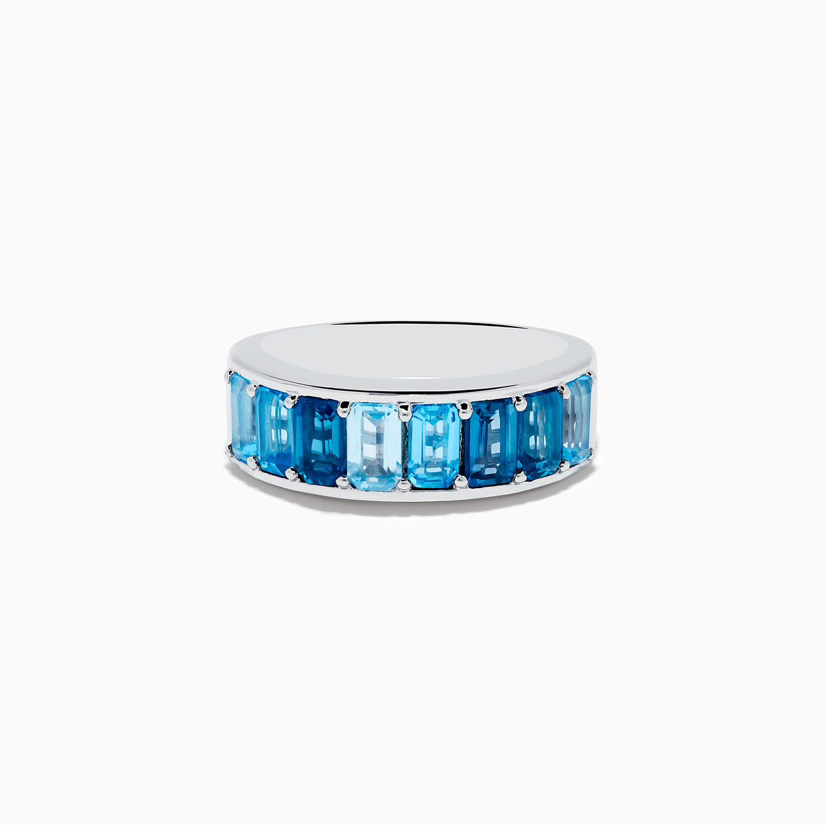 The Ocean Bleu 925 Sterling Silver Blue Topaz Ring features a continuous band of rectangular blue topaz gemstones in varying shades, set side by side, and is displayed against a plain white background.
