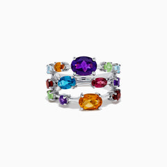 The 925 Sterling Silver Multi Color Gemstone 3 Row Band showcases three stacked rings with vibrant purple, blue, green, orange, and red gemstones set on a sleek silver background.