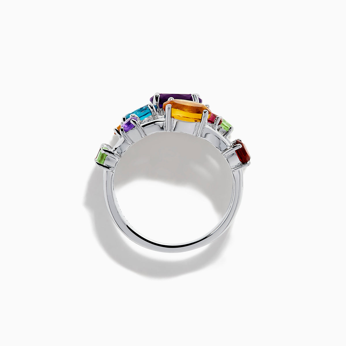 The 925 Sterling Silver Multi Color Gemstone 3 Row Band showcases three stacked rings with vibrant purple, blue, green, orange, and red gemstones set on a sleek silver background.