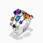 The 925 Sterling Silver Multi Color Gemstone 3 Row Band showcases three stacked rings with vibrant purple, blue, green, orange, and red gemstones set on a sleek silver background.