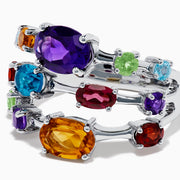 The 925 Sterling Silver Multi Color Gemstone 3 Row Band showcases three stacked rings with vibrant purple, blue, green, orange, and red gemstones set on a sleek silver background.
