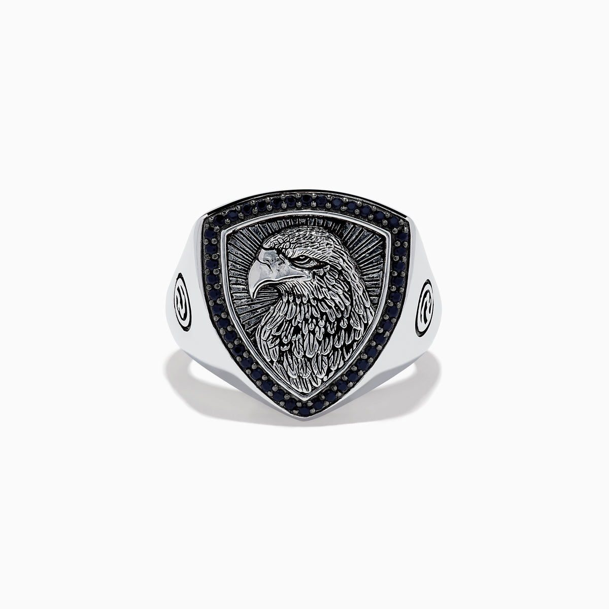 The Mens 925 Sterling Silver Black Spinel Eagle Shield Ring features an engraved eagle head on a shield-shaped face, accented with black spinel and detailed feather patterns on the eagle.
