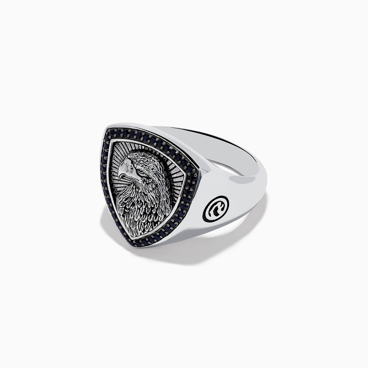 The Mens 925 Sterling Silver Black Spinel Eagle Shield Ring features an engraved eagle head on a shield-shaped face, accented with black spinel and detailed feather patterns on the eagle.