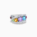 The Mosaic 925 Sterling Silver Multi Color Gemstone Ring features a row of red, green, yellow, purple, and blue gemstones accented by clear stones surrounding the band.