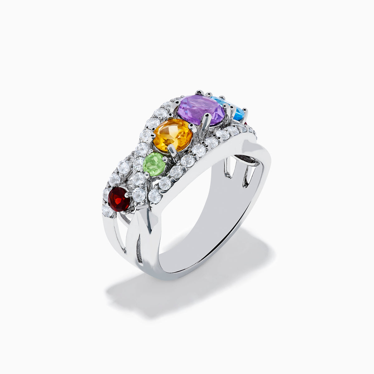 The Mosaic 925 Sterling Silver Multi Color Gemstone Ring features a row of red, green, yellow, purple, and blue gemstones accented by clear stones surrounding the band.