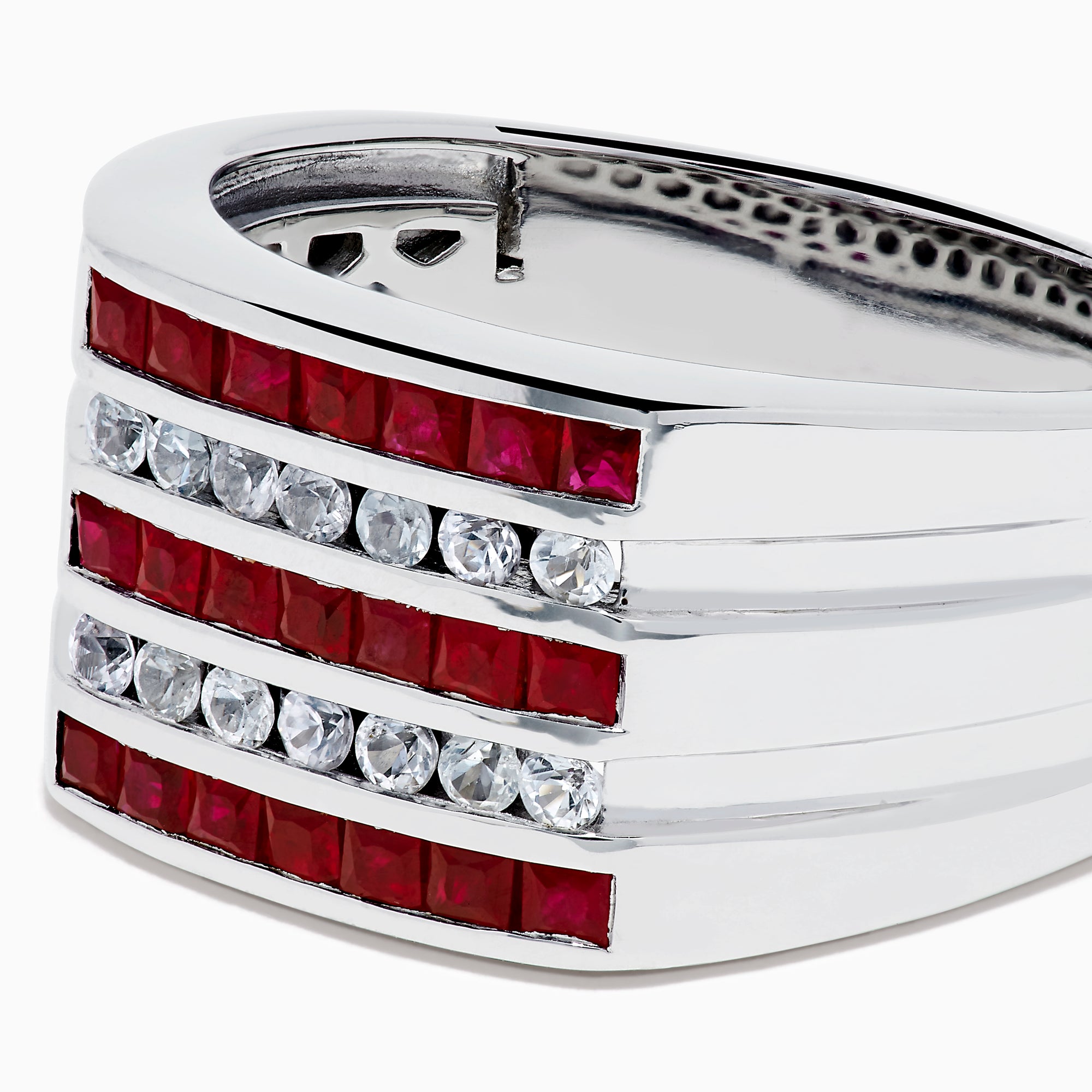 The Men's 925 Sterling Silver Channel Set Ruby and Sapphire Ring showcases a bold, wide band with three rows: ruby stones on the top and bottom and sapphires in the center, creating a modern geometric design.