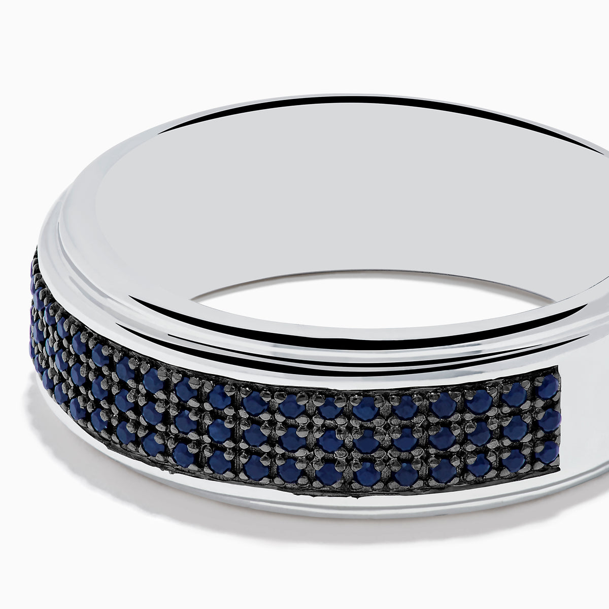 The Mens 925 Sterling Silver Black Sapphire Band Ring features a wide sterling silver band with a central row of black sapphires, creating an elegant mens ring displayed against a plain white background.