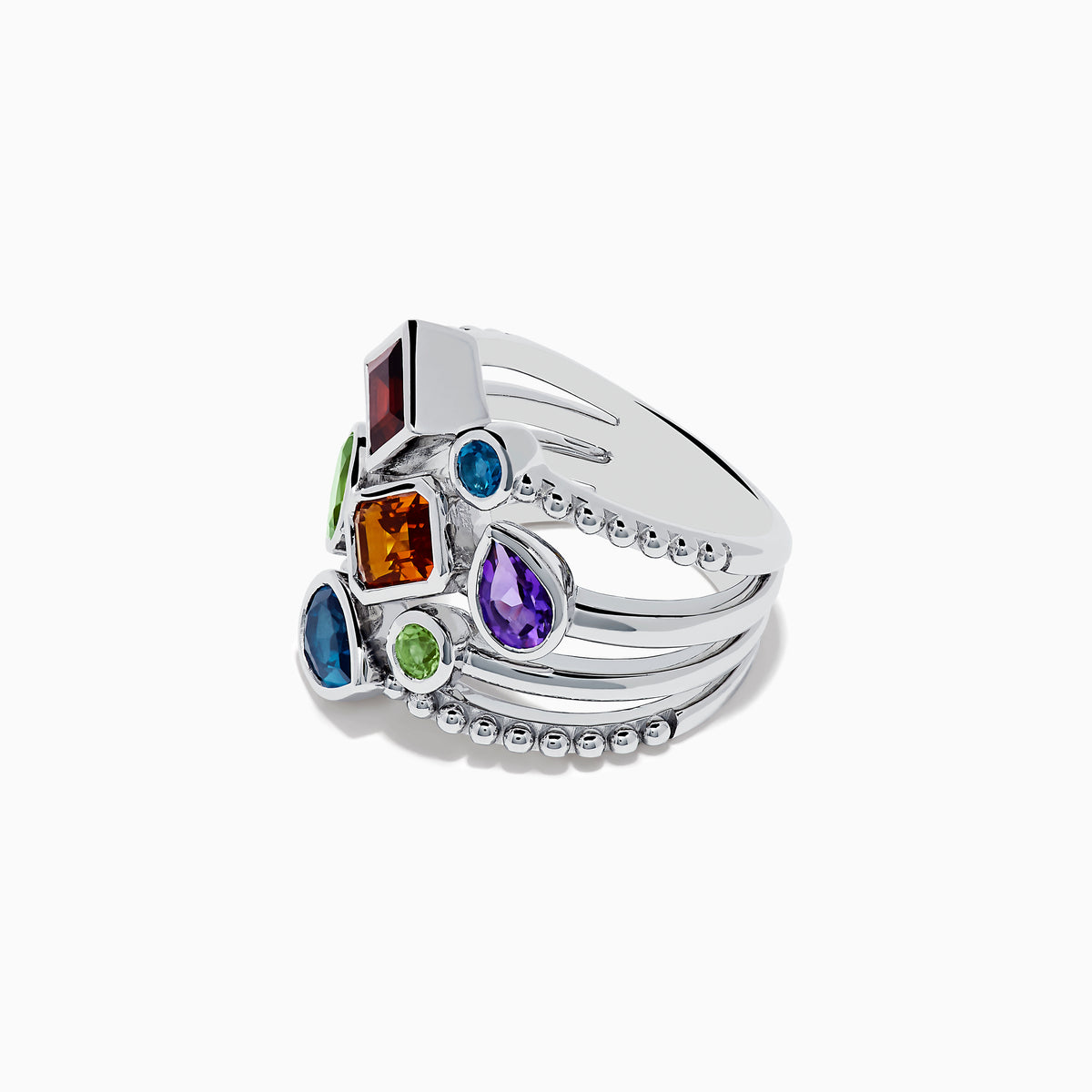 The Mosaic 925 Sterling Silver Multi Gemstone Ring showcases colorful blue, green, red, orange, and purple gemstones in various shapes on intertwined sterling silver bands.