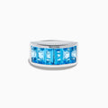 The Ocean Bleu 925 Sterling Silver Blue Topaz Ring features seven rectangular blue topaz gemstones set in a row across the front.