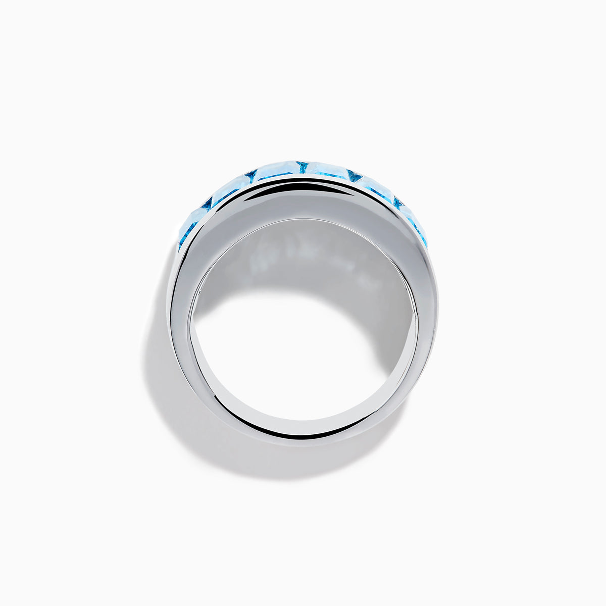 The Ocean Bleu 925 Sterling Silver Blue Topaz Ring features seven rectangular blue topaz gemstones set in a row across the front.