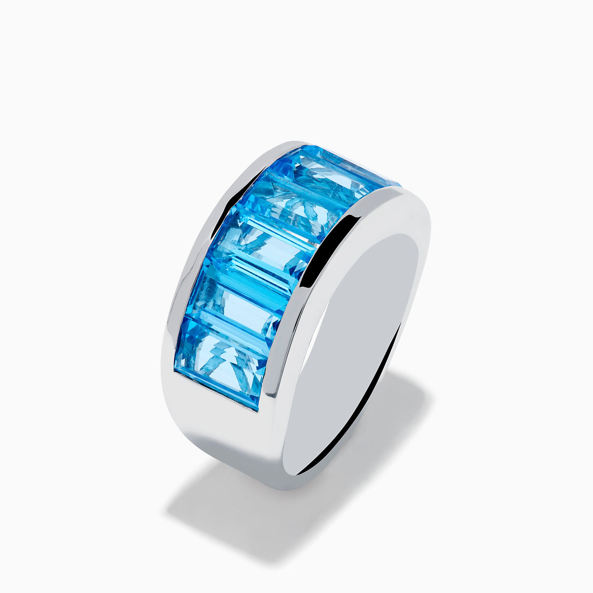 The Ocean Bleu 925 Sterling Silver Blue Topaz Ring features seven rectangular blue topaz gemstones set in a row across the front.