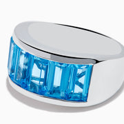 The Ocean Bleu 925 Sterling Silver Blue Topaz Ring features seven rectangular blue topaz gemstones set in a row across the front.