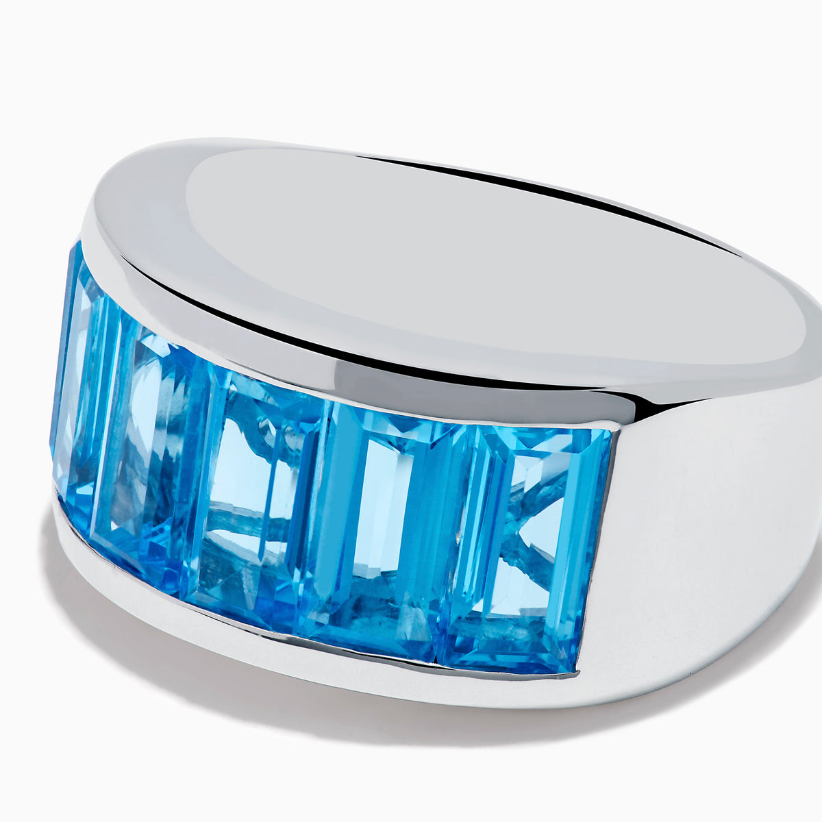The Ocean Bleu 925 Sterling Silver Blue Topaz Ring features seven rectangular blue topaz gemstones set in a row across the front.
