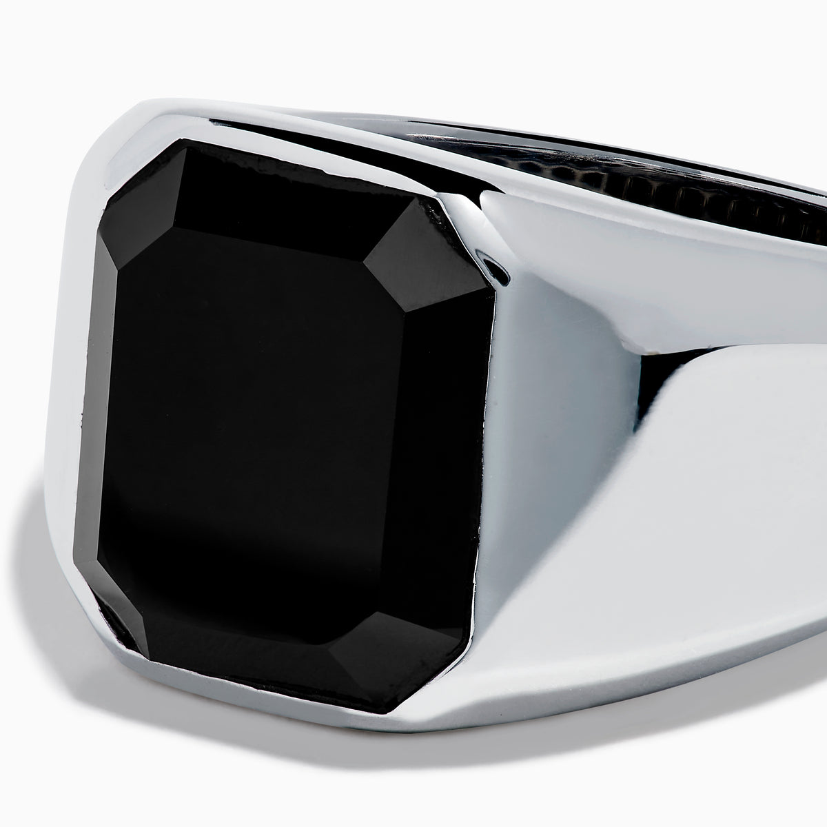 The Men's 925 Sterling Silver Onyx Ring showcases a wide band with a large rectangular black onyx set in the center, shown against a plain white background.