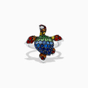 The 925 Seaside Sterling Silver Multi Sapphires Turtle Ring features a turtle design with blue, green, red, yellow, orange, and black sapphires on its shell, head, and flippers for a vibrant look.