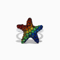 The 925 Sterling Silver Multi Color Sapphire Starfish Ring features a starfish shape adorned with vibrant rainbow sapphires.