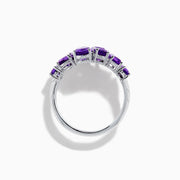 The 925 Sterling Silver Amethyst Bypass Ring showcases seven faceted purple gemstones of assorted shapes and sizes set in a sleek, modern open design against a plain white background.