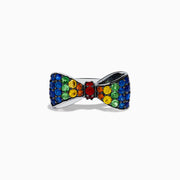 The Safari 925 Sterling Silver Multi Color Sapphire Bow Ring features red, yellow, green, and blue sapphires arranged symmetrically in a bow design against a white background.