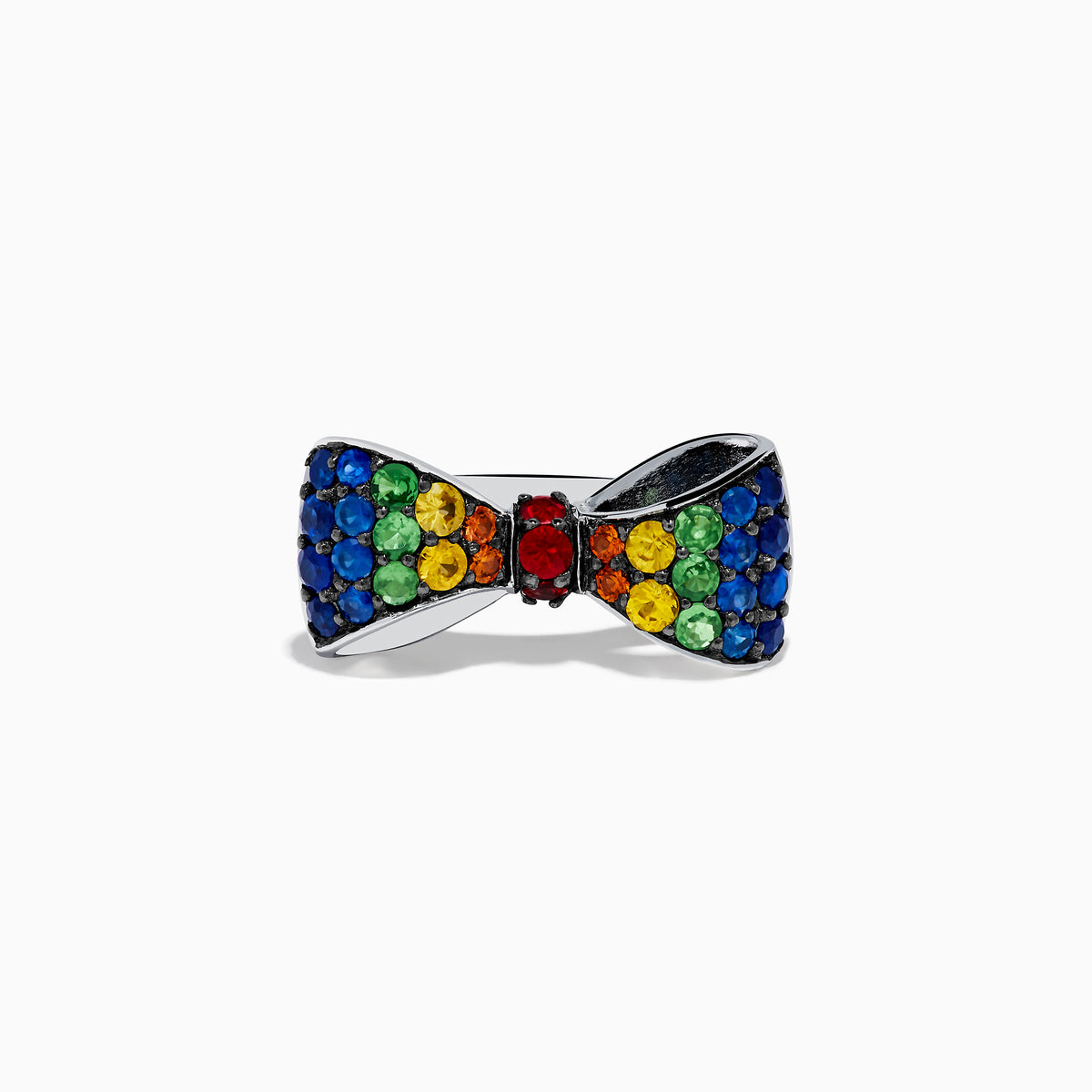 The Safari 925 Sterling Silver Multi Color Sapphire Bow Ring features red, yellow, green, and blue sapphires arranged symmetrically in a bow design against a white background.