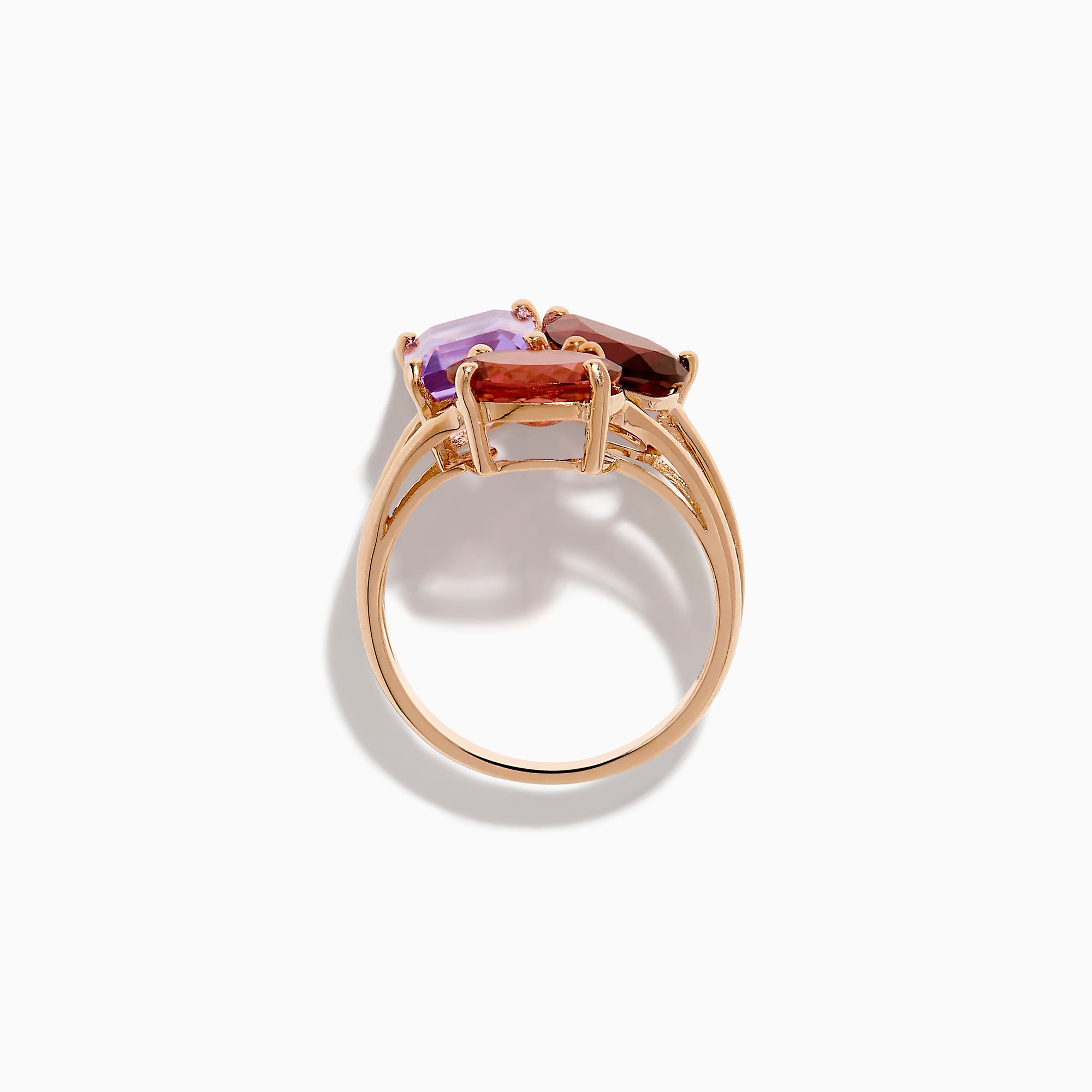 The 14K Rose Gold Pink Amethyst, Tourmaline & Rhodolite Cocktail Ring showcases a pink amethyst, deep red tourmaline, and faceted purple rhodolite in delicate prongs for a stunning cocktail look.