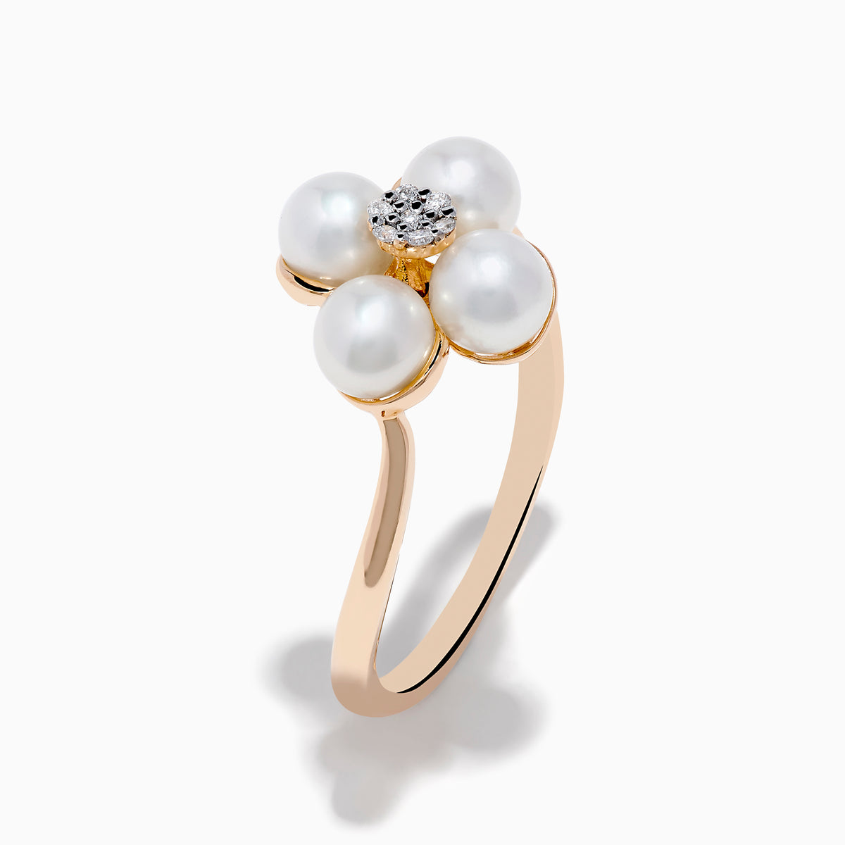 The 14K Rose Gold Fresh Water Pearl and Diamond Flower Ring features petal-shaped pearls and a central cluster of small diamonds, beautifully displayed on a white background.