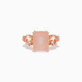 The 14K Rose Gold Pink Rose Quartz, Pink Opal and Morganite Ring features a large rectangular pink quartz center, flanked by two oval pink opals on a simple band, shown against a white background.