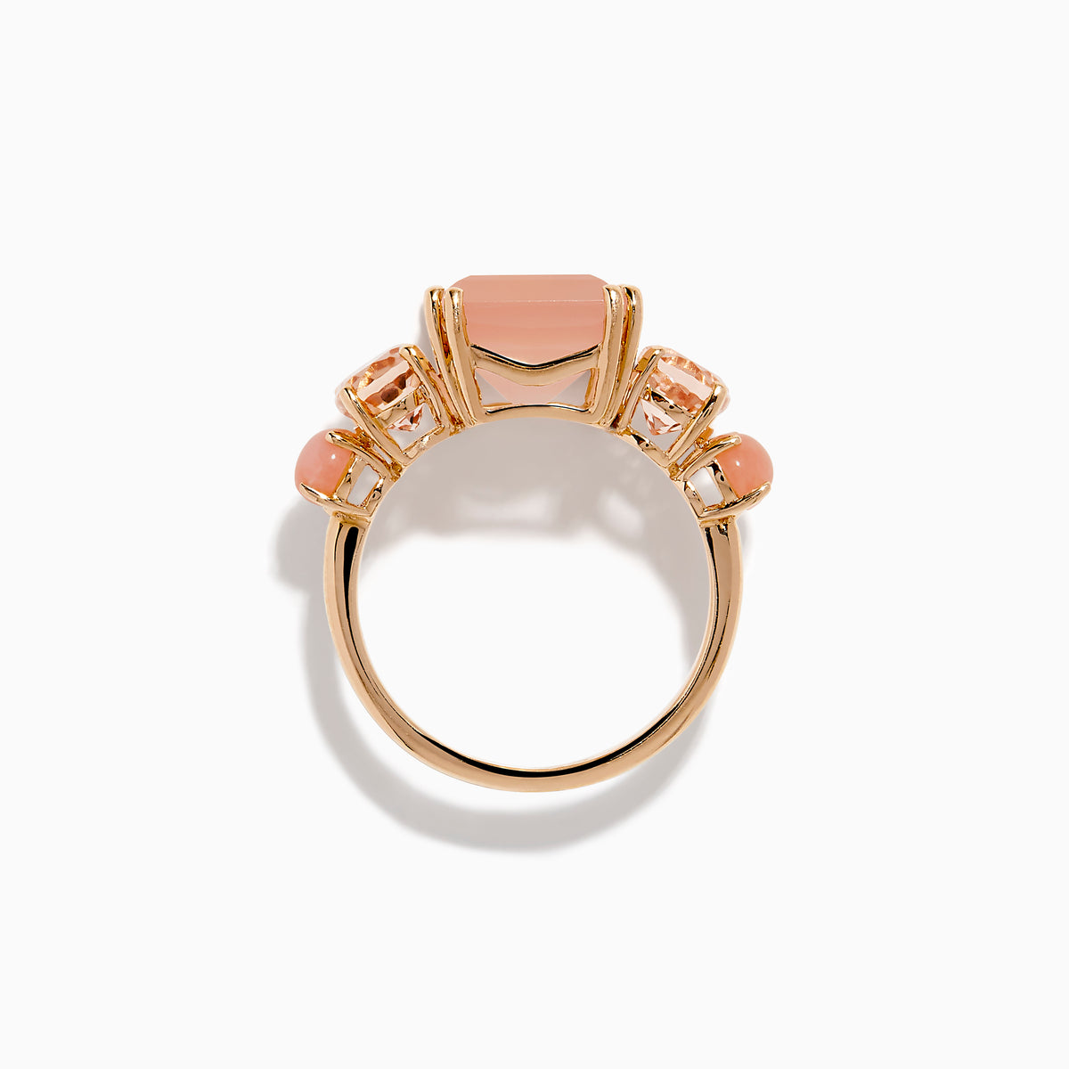 The 14K Rose Gold Pink Rose Quartz, Pink Opal and Morganite Ring features a large rectangular pink quartz center, flanked by two oval pink opals on a simple band, shown against a white background.
