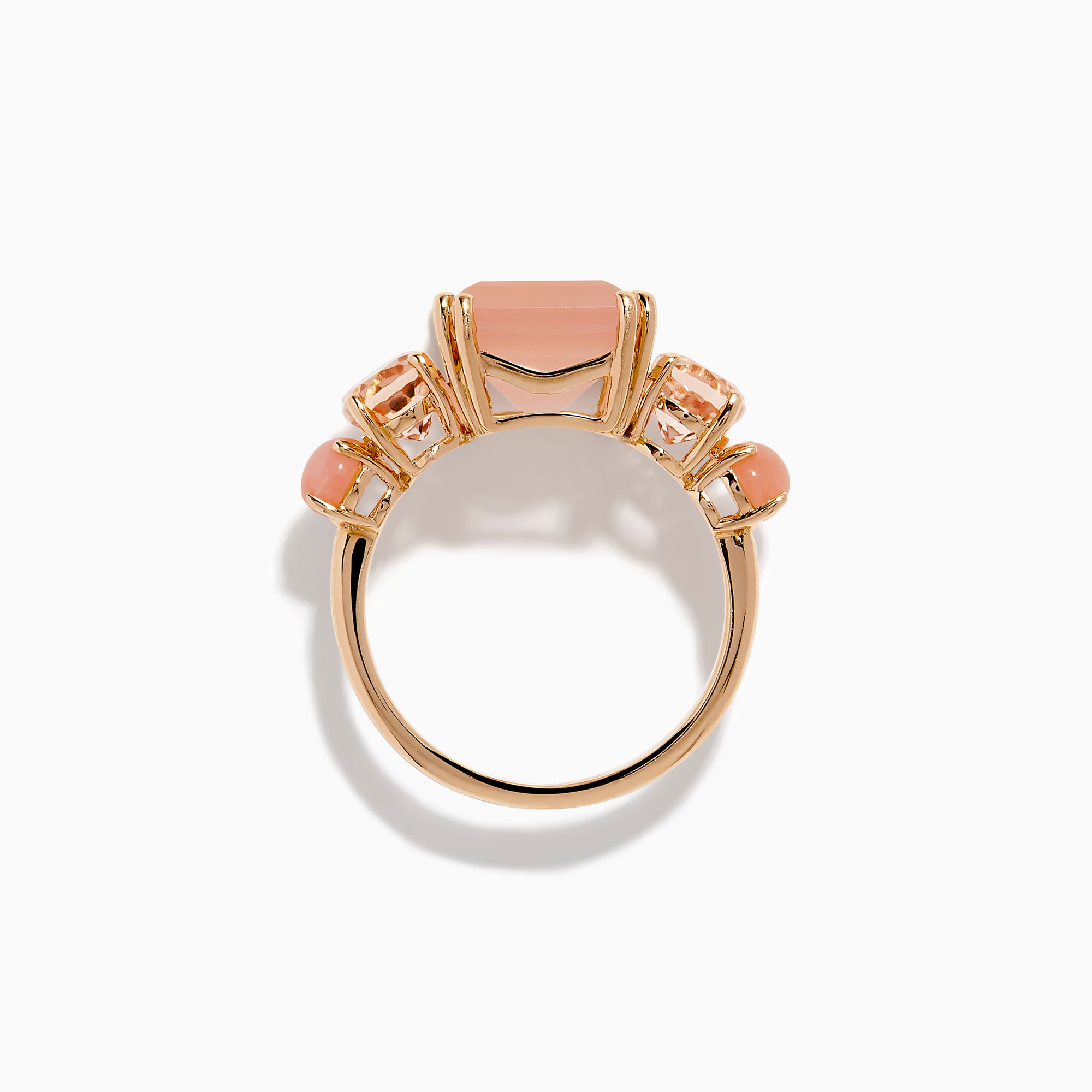 The 14K Rose Gold Pink Rose Quartz, Pink Opal and Morganite Ring features a large rectangular pink quartz center, flanked by two oval pink opals on a simple band, shown against a white background.
