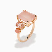 The 14K Rose Gold Pink Rose Quartz, Pink Opal and Morganite Ring features a large rectangular pink quartz center, flanked by two oval pink opals on a simple band, shown against a white background.