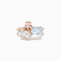 The 14K Rose Gold Semi Precious Mix Stone and Diamond Ring features three bold gemstones in peach, light green, and light blue, accented with diamonds on a rose gold band. Displayed on a white background.
