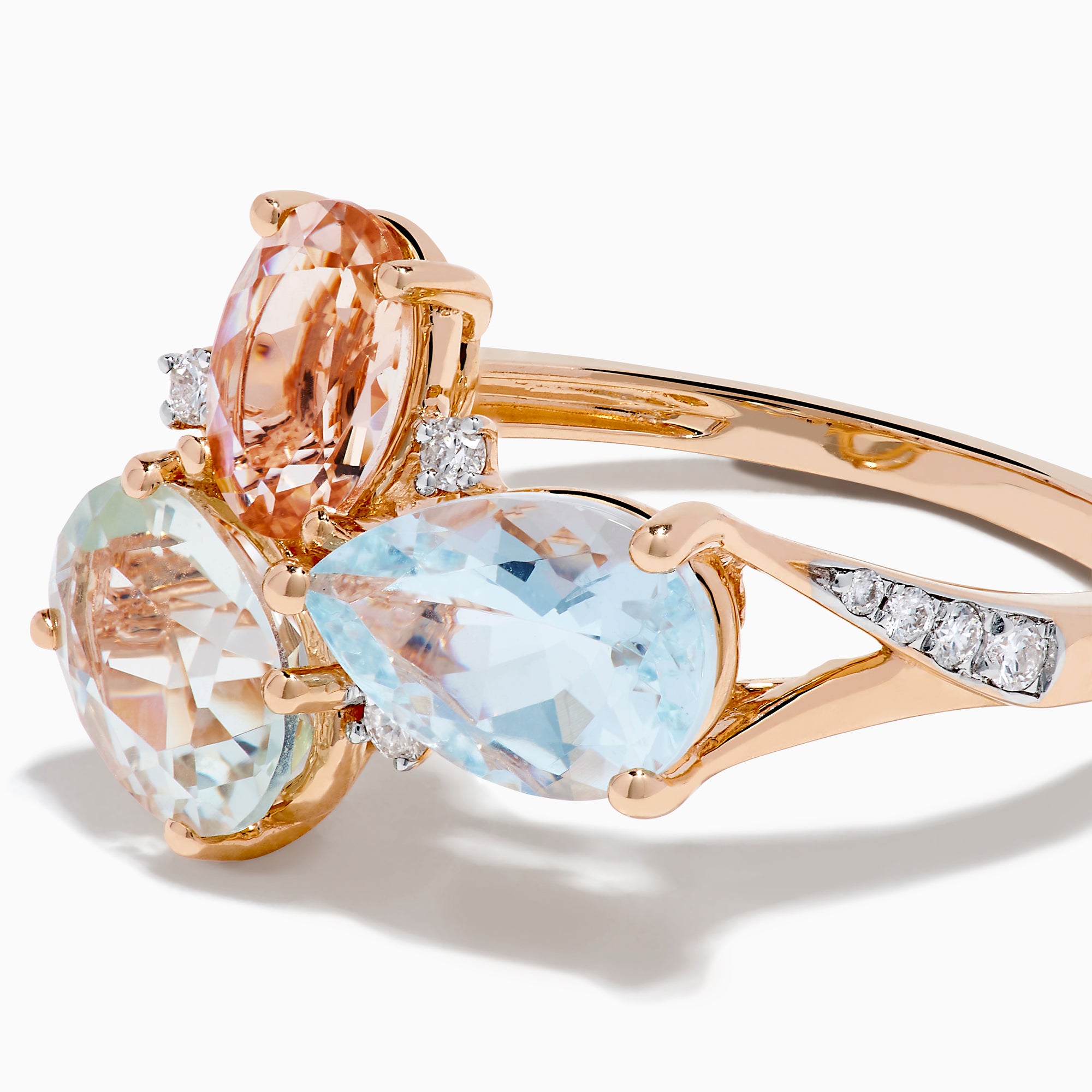 The 14K Rose Gold Semi Precious Mix Stone and Diamond Ring features three bold gemstones in peach, light green, and light blue, accented with diamonds on a rose gold band. Displayed on a white background.