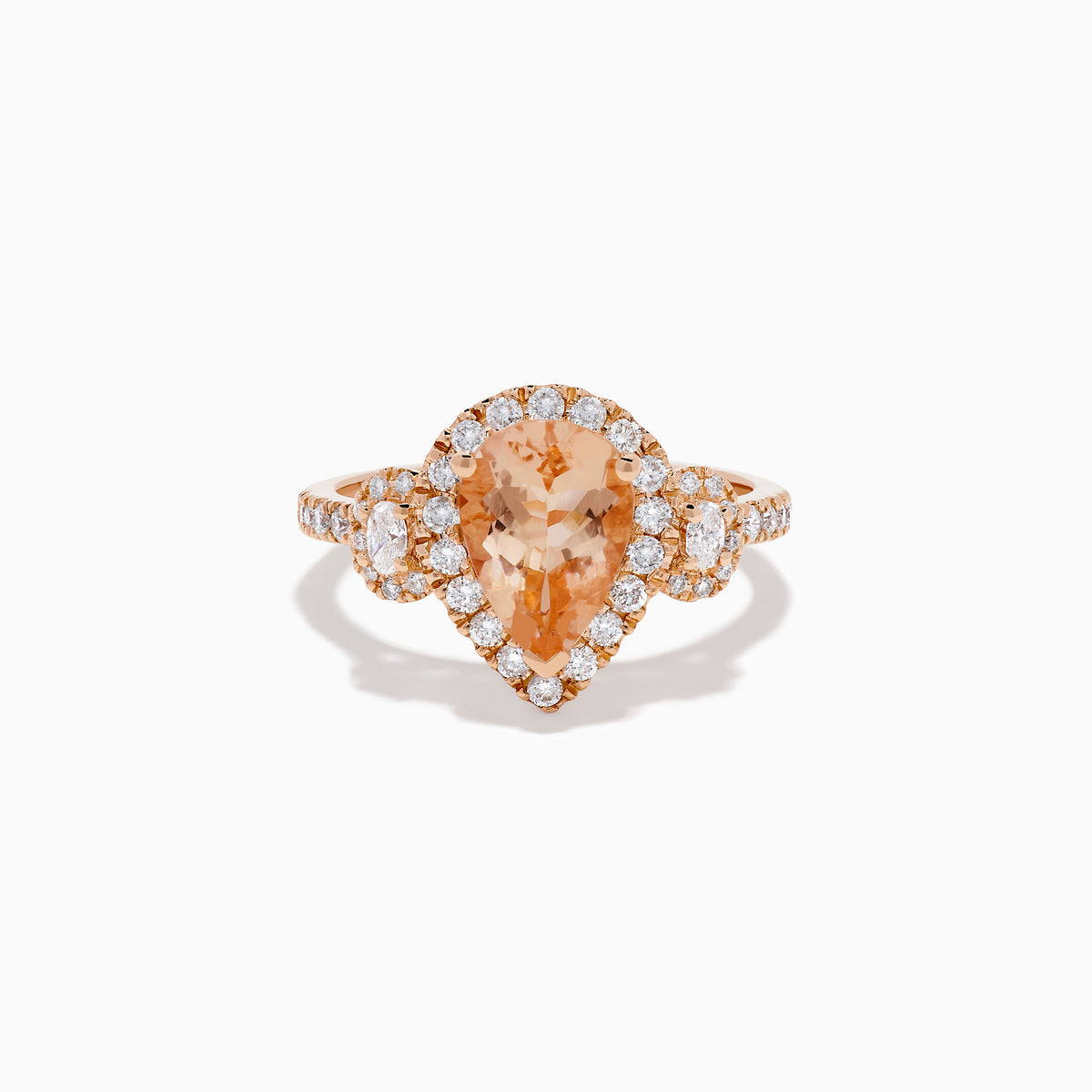 The 14K Rose Gold Pear Morganite and Diamond Halo Ring showcases a peach-hued pear morganite with sparkling diamond halo and accents, all set in 14K rose gold, against a white background.