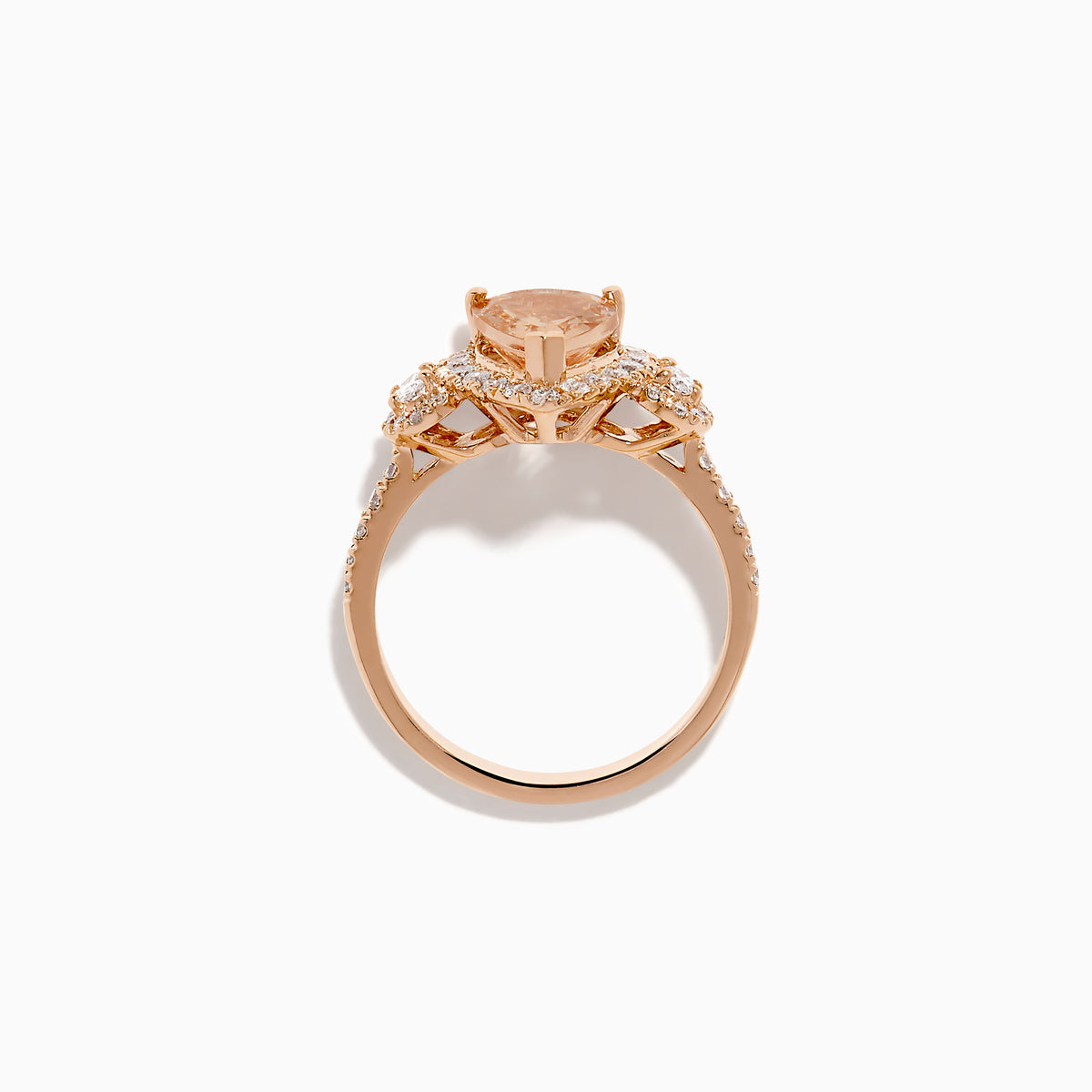 The 14K Rose Gold Pear Morganite and Diamond Halo Ring showcases a peach-hued pear morganite with sparkling diamond halo and accents, all set in 14K rose gold, against a white background.